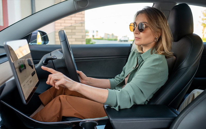 woman sitting in EV
