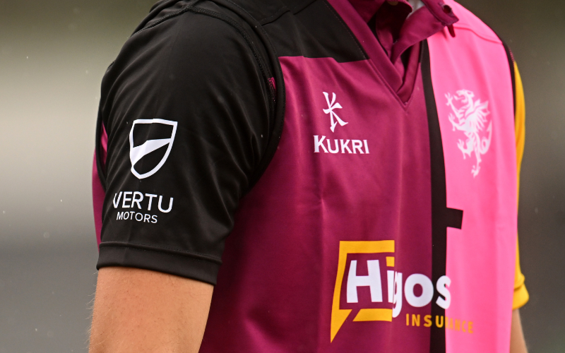 Vertu branding on shirt sleeve