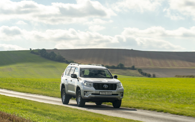 Toyota Land Cruiser driving along country road